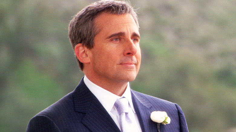 Michael Scott of Steve Karel stands in a wedding suit in the office