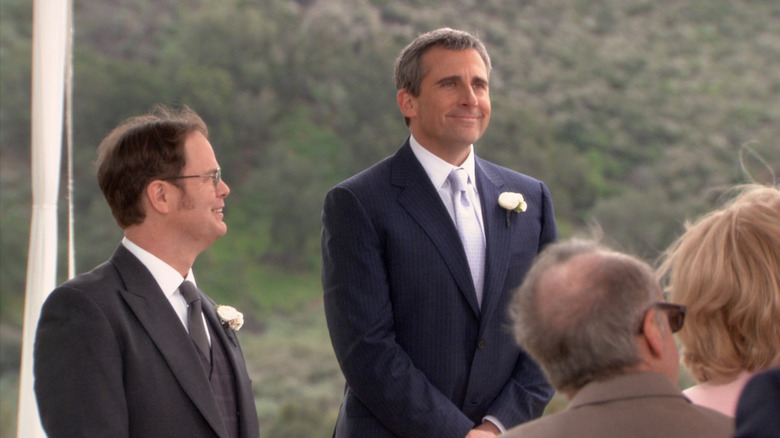 Rhein Wilson's Dwight Shar looks through Michael Scott Steve Karel during the Dwight wedding ceremony in the office