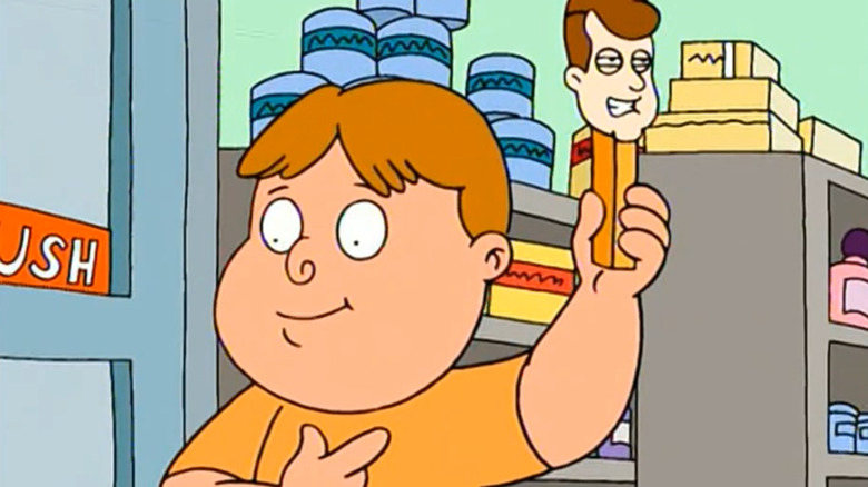 A child holding up a JFK Pez dispenser on Family Guy