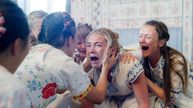 Dani screaming with The Harga in Midsommar.