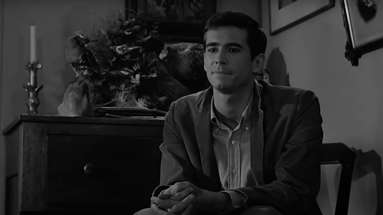 Anthony Perkins' Norman Bates sits in a chair in Psycho