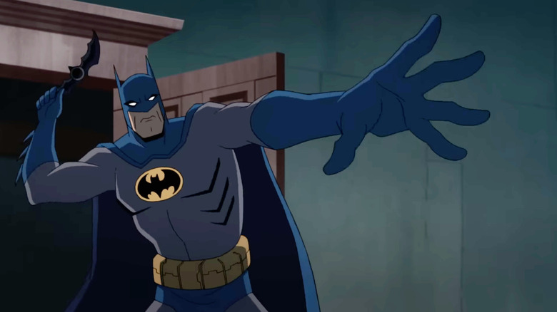 Batman about to throw a batarang in Batman vs. Teenage Mutant Ninja Turtles