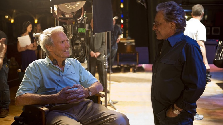 Clint Eastwood and Frankie Valli chatting on the set of Jersey Boys