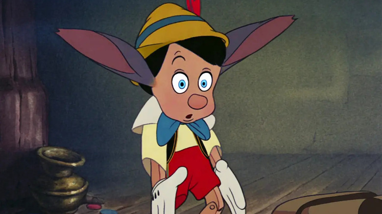 Pinocchio begins to turn into a donkey into a pinocio