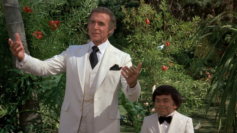 Ricardo Montalbán's Mr. Roarke and Hervé Villechaize's Tattoo stand side by side in Fantasy Island