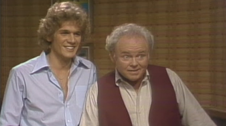 Dean Scofield's Fred Rooney with Carroll O'Connor's Archie Bunker smiling on Archie Bunker's Place