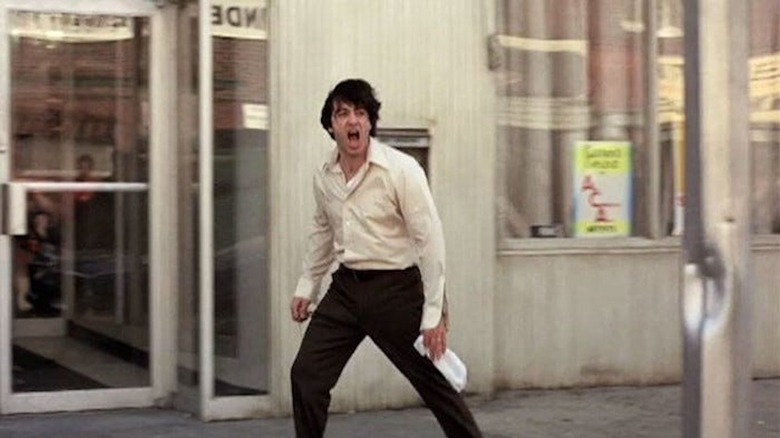 Al Pacino shouts "Attica" outside a Brooklyn bank in Dog Day Afternoon