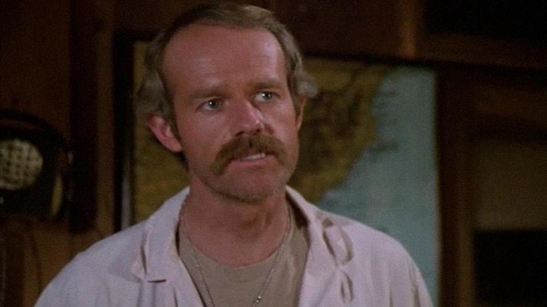 Mike Farrell looking angry on M*A*S*H