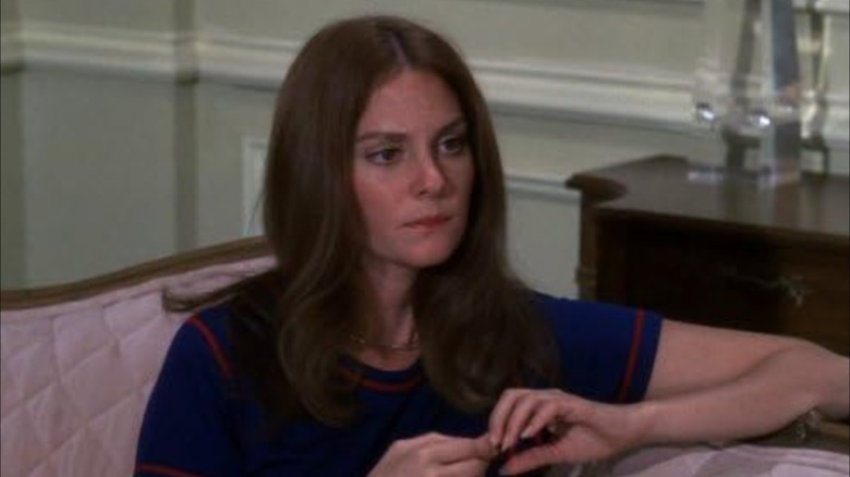 Lesley Ann Warren as Dana in Mission: Impossible, sitting on a couch