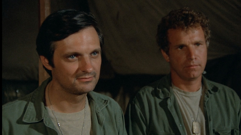 Hawkeye and Trapper standing side by side on M*A*S*H