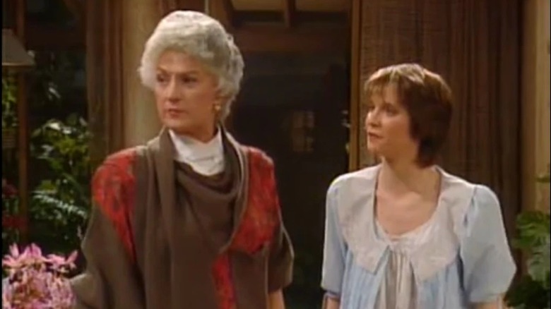 Deena Freeman as Kate Griffiths and Bea Arthur as Dorothy Zbornak appear upset in The Golden Girls