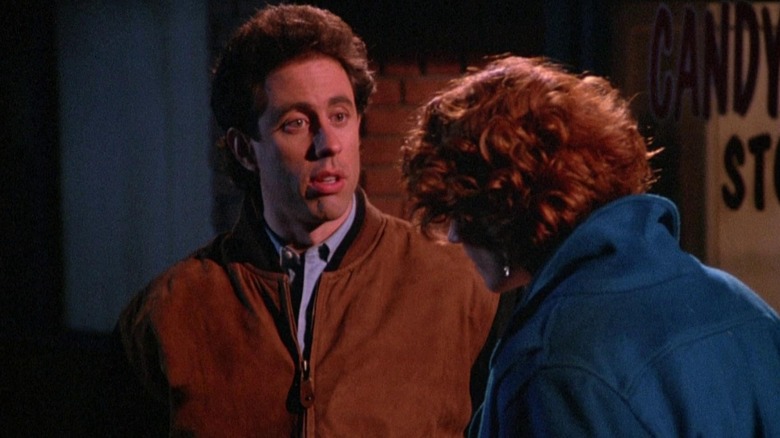 Jerry Seinfeld's Jerry looks surprised by Melinda McGraw's Angela (facing us) on Seinfeld