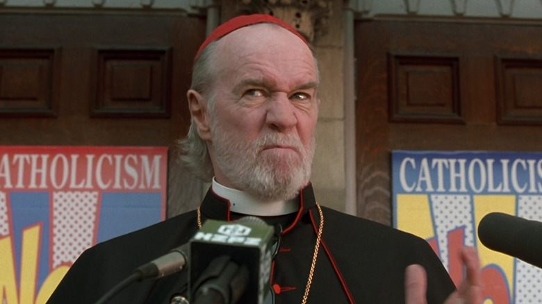 Cardinal Ignatius Glik makes a funny face while talking on the podium in dogma