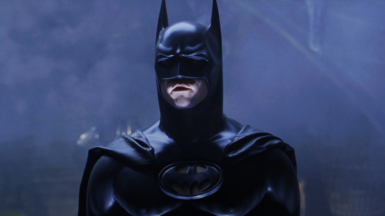 Batman at Val Kilmer stands in Batkave in Batman forever