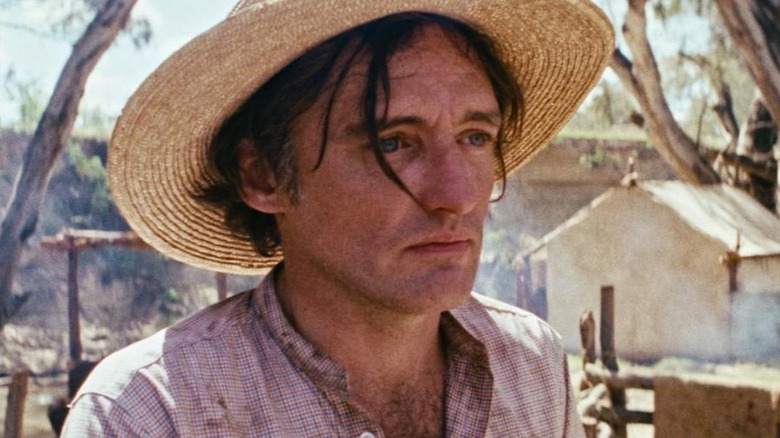 Dennis Hopper as Dan Morgan looking solemn in Mad Dog Morgan