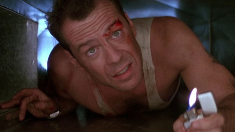 Bruce Willis crawling through a vent in Die Hard 