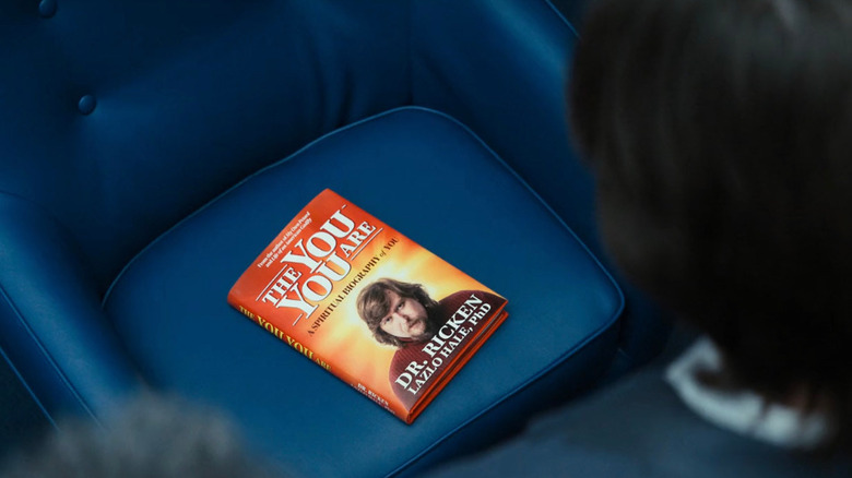 A book entitled "The You You Are" sitting on a blue chair