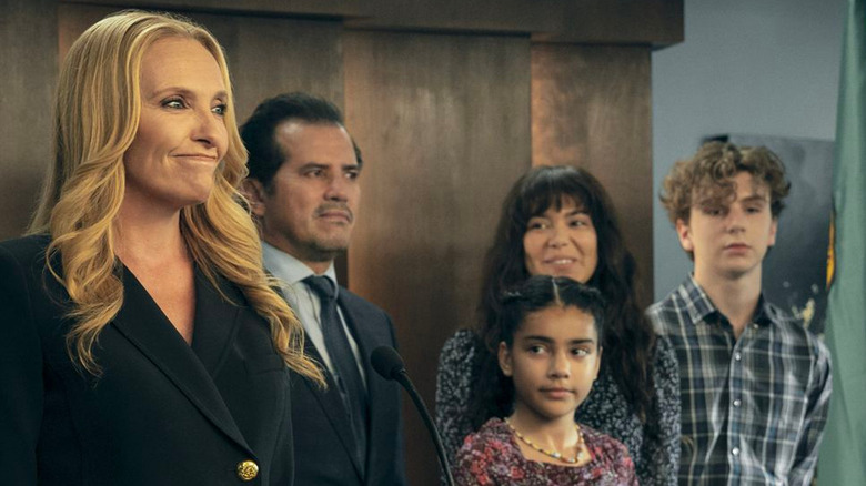 Margot Cleary Lopez (Toni Collette) with her husband Rob (John Leguizamo) and children in The Power