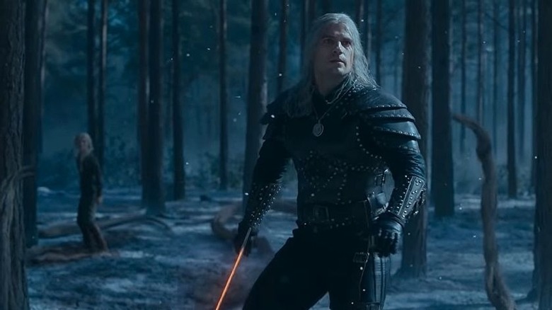 Henry Cavill as Geralt of Rivia, preparing to fight a monster in The Witcher season 2