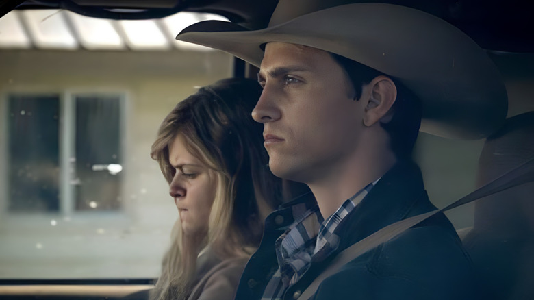 Young Jamie and Beth sitting in a car on Yellowstone