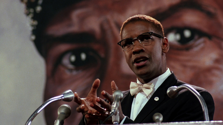 Malcolm X, as played by Denzel Washington, giving a speech