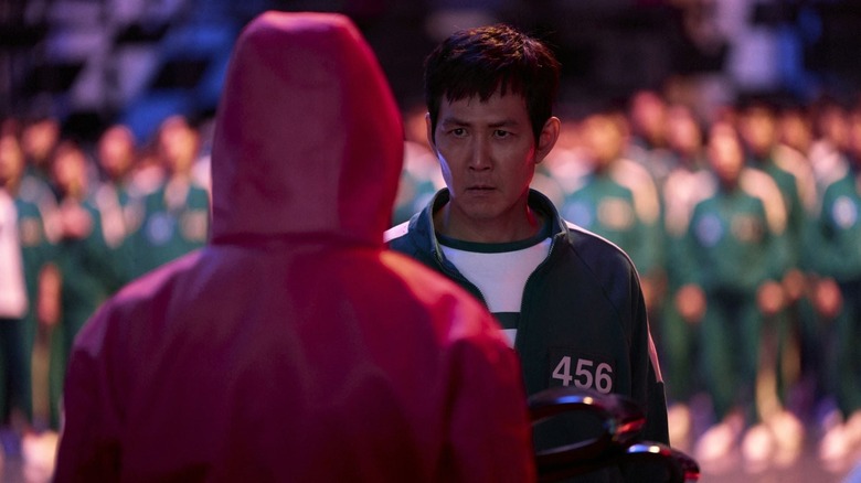 Gi-hun faces off with a guard in Squid Game season 2