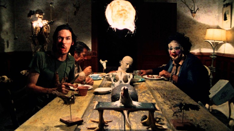 The cannibal family, including Leatherface, sitting around the dinner table in "The Texas Chain Saw Massacre."