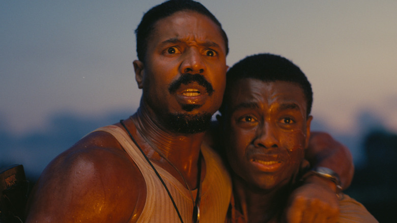 Michael B. Jordan as one of the Smoke brothers with a horrified look on his face in a scene from Sinners