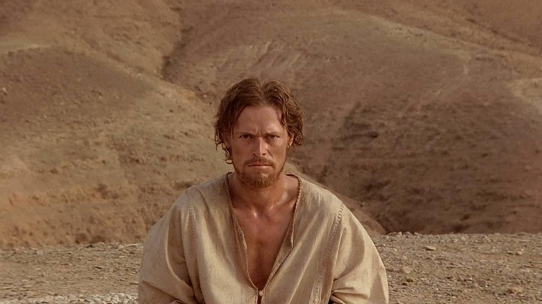 Jesus Christ sitting in the desert in The Last Temptation of Christ