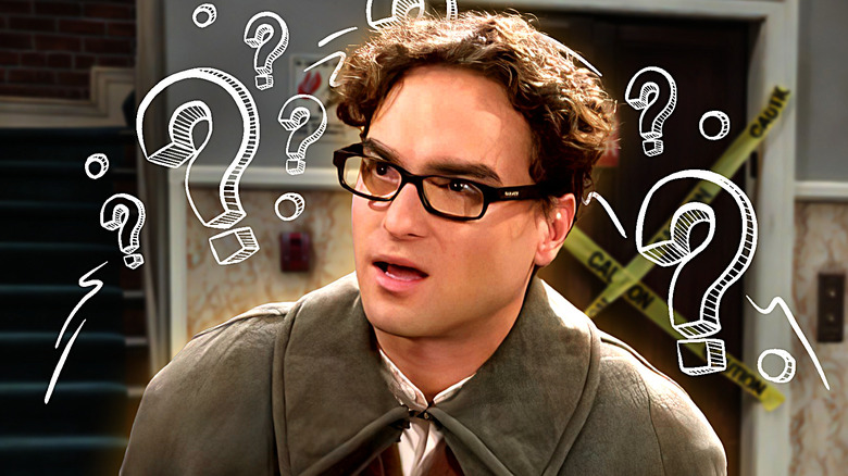 Leonard in a cloak with question marks around his head on The Big Bang Theory