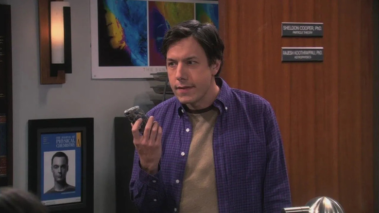 Barry Kripke angrily holding a phone on The Big Bang Theory