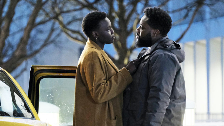 Mina and A.J. talking outside of a car on The Resident