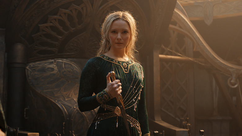 Galadriel stands holding dagger