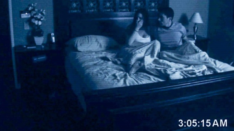 Couple terrified in bed