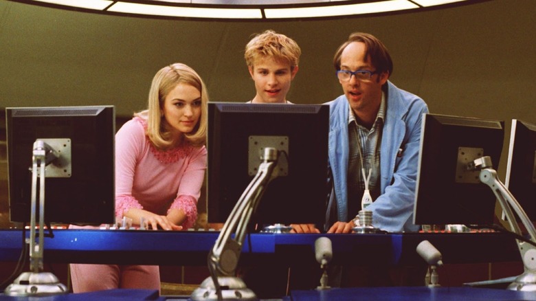 Lady Penelope, Alan Tracy, and Brain working on computers in the movie Thunderbirds