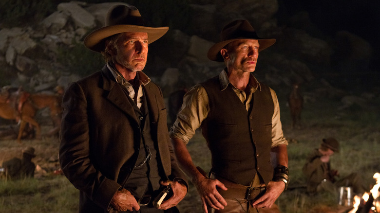 Harrison Ford as Colonel Woodrow Dolarhyde and Daniel Craig as Jake Lonergan in Cowboys & Aliens