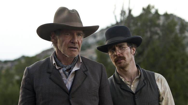 Harrison Ford as Colonel Woodrow Dolarhyde and Sam Rockwell as Doc in Cowboys & Aliens