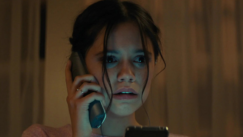 Jenna Ortega as Tara Carpenter, scared on the phone in Scream 6