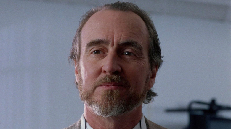 Wes Craven smiling as Dr. Arnold in The Fear