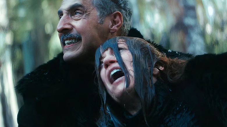 John Turturro's Irving grimacing and holding Britt Lower's screaming Helena Eagan on Severance