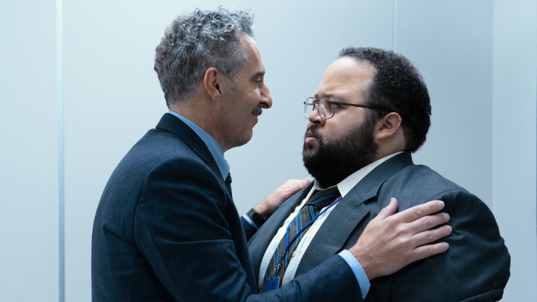 John Turturro's Irving B holding Zach Cherry's Dylan G. on Severance