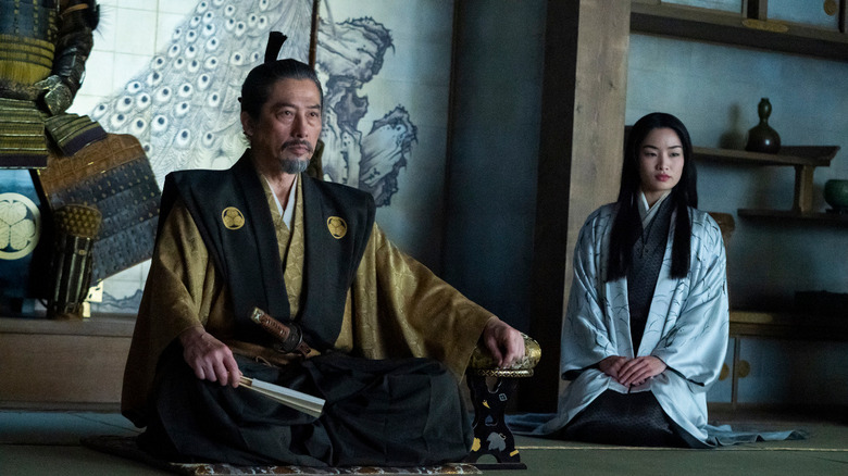 Toranaga and Mariko sit cross-legged on the floor wearing formal attire in Shōgun