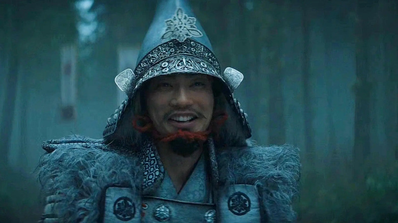 Saeki smiles wearing armor in the forest on Shōgun