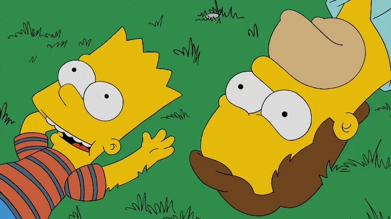 Bart lies in the grass with an annoyed Homer in The Simpsons