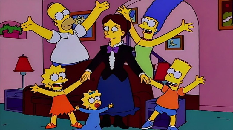 The Simpson family raises their hands celebrating with Shary Bobbins in The Simpsons