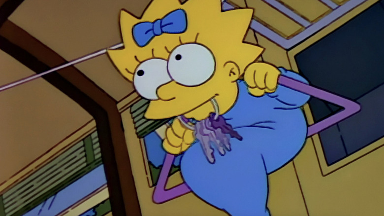 Maggie slides over the improvised clasp in the Simpsons