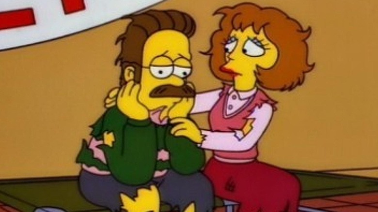 Ned Flanders looking down while Maude tries to comfort him in The Simpsons