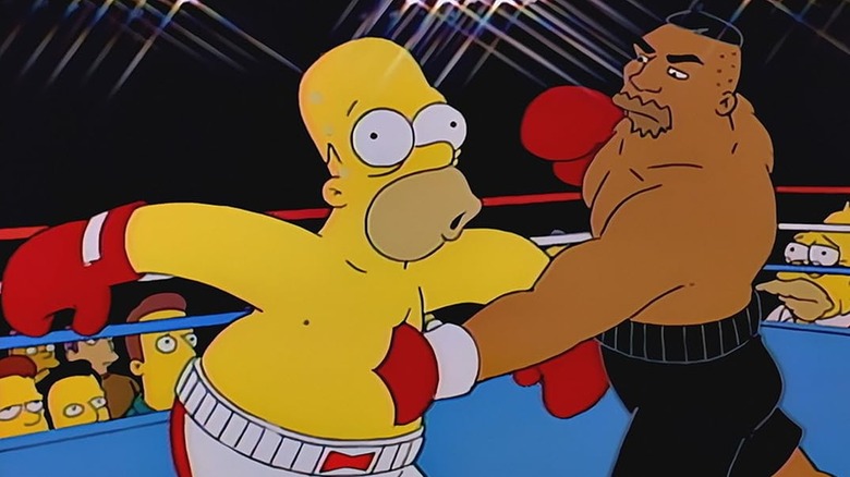 Homer sendo socado no estômago por Drederick Tatum nos Simpsons