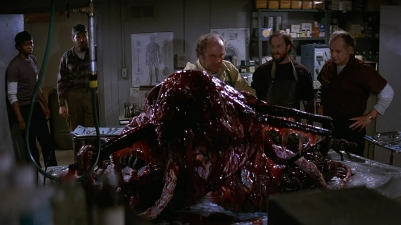 Wilford Brimley looks at creature The Thing