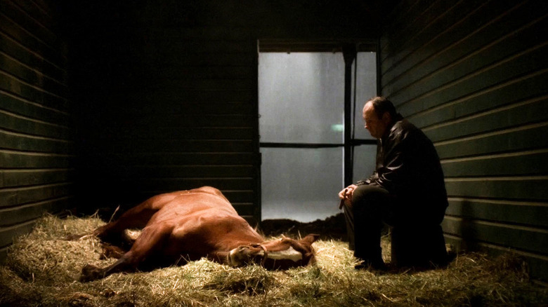 James Gandolfini as Tony Soprano sitting with a sick horse called Pie-O-My in The Sopranos